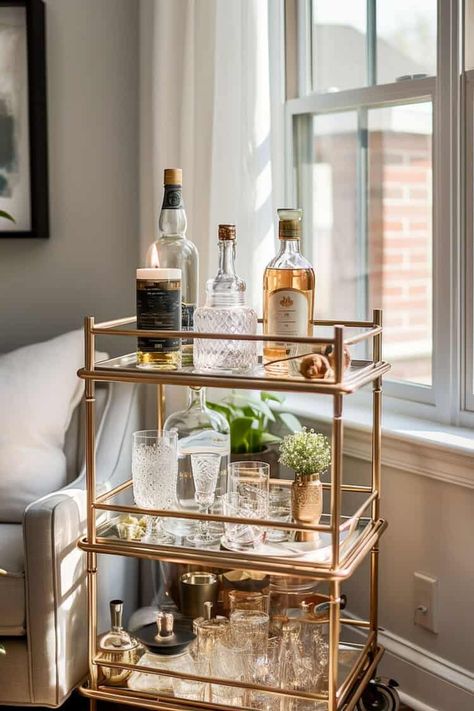 Bar carts are a great alternative to stationary wet and dry bars. These vintage bar cart styles will bring a classy, fun look to your home. Vintage Bar Cart Styling, Bar Cart Decor Ideas, Globe Bar, Modern Bar Cart, Home Bar Areas, Rolling Bar Cart, Nautical Theme Decor, Glass Bar Cart, Bar Cart Styling