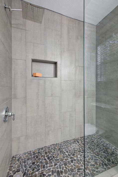 Walk-in Shower with Chrome Fixtures, and flat river rock shower floor Shower Floor Rock Tile, Grey River Rock Shower Floor, Stone Floor Shower River Rocks, Walk In Shower With Stone Floor, Walk In Shower Designs Tile Modern, Pebble Rock Shower Floor, Shower With Pebble Floor River Rocks, Stone Shower Floor Rocks, Showers With River Rock Floors