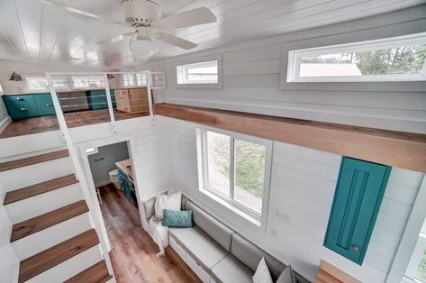 The Gallaway, a 28ft custom tiny home by Modern Tiny Living! With a front porch, galley kitchen, mudroom, and dual lofts, it has everything you need for full-time living. Teal Kitchen Cabinets, Minimalist Lifestyle Simple Living, Tiny Homes On Wheels, Kitchen Mudroom, Homes On Wheels, White Farmhouse Sink, Teal Kitchen, White Shiplap Wall, White Shiplap