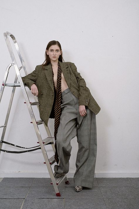 Nothing suits me like a suit | English | Metal Magazine Ladder Fashion Editorial, Posing With Ladder, Ladder Photoshoot Photo Ideas, Ladder Photoshoot, Ladder Photography, Warehouse Photoshoot, Storm Fashion, Creative Fashion Photography, Fashion Model Poses