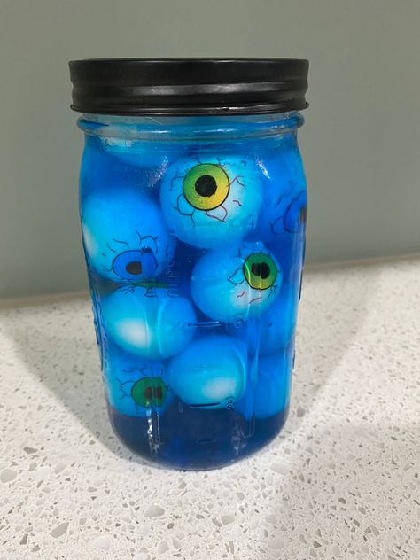 Fill jar half way with Dollar Tree eyeballs, pour dishsoap halfway over top,add more eyeballs to push others down, add lid. Jar Of Eyeballs Tattoo, Eyeballs In A Jar Halloween, Head In Jar Halloween, Head In A Jar Halloween, Mask In Jar Halloween, Water Halloween, Jar Of Eyeballs, Halloween Run, Backyard Halloween Party