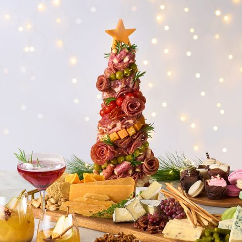 Create an impressive Christmas tree appetizer topped with a cheddar cheese star. Discover how to make elegant charcuterie roses to decorate the foam cone base for a festive touch. Pineapple Christmas Tree Charcuterie, Appetizer Board Christmas, Foam Christmas Tree Appetizer, Styrofoam Christmas Tree Charcuterie, Charcuterie Christmas Trees, Christmas Antipasto Tree, Cone Christmas Tree Charcuterie, Foam Christmas Tree Charcuterie, How To Make A Charcuterie Christmas Tree