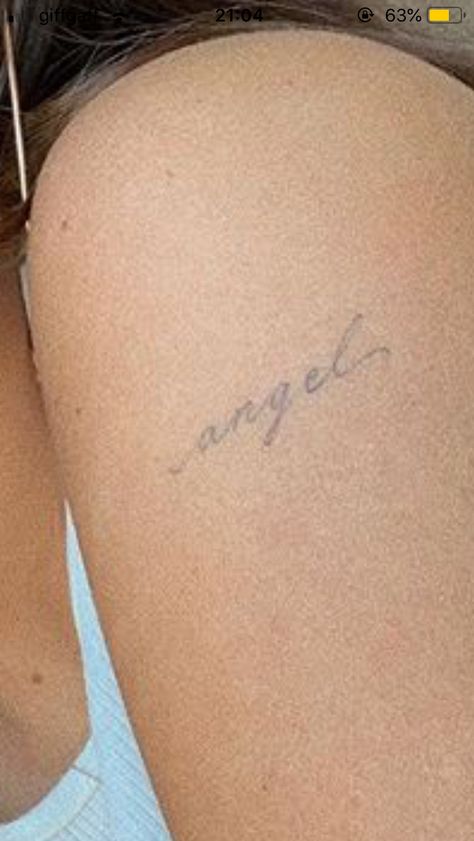 Angel In Cursive Tattoo, Angel Tattoo Dainty, Angel Cursive Tattoo, Angel Script Tattoo, Angel Tattoo Aesthetic, Angelic Tattoos For Women, Word Angel Tattoo, Angel Tattoo Writing, Faint Tattoo