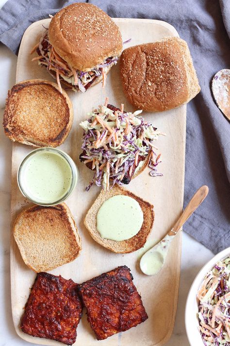 Barbecue tempeh burgers with creamy ranch slaw - perfect for summer cookouts Barbecue Tempeh, Veggie Potstickers, Ranch Slaw, Tempeh Burger, Creamy Slaw, Bbq Tempeh, Ranch Burgers, Vegan Tempeh, Vegetarian Eating