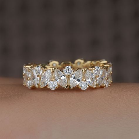 5.5MM Marquise and Round Moissanite Wedding Band, 14K Gold Full Eternity Ring, Lab Grown Diamond Ring, Wide Anniversary Bridal Matching Band ● 𝐃𝐢𝐚𝐦𝐨𝐧𝐝 𝐃𝐞𝐭𝐚𝐢𝐥𝐬: ➢ Shape: Marquise Cut and Round Cut ➢ Diamond Type: Lab Grown Diamond ( EF - VS) / Moissanite ( DE - VVS) ➢ Carat:  3.3 TCW apx 𝐑𝐢𝐧𝐠 𝐃𝐞𝐭𝐚𝐢𝐥𝐬: ➢ Shank Width : 5.5 MM ➢ Shank Thickness : 1.8 MM 𝐀𝐥𝐥 𝐥𝐢𝐬𝐭𝐞𝐝 𝐫𝐢𝐧𝐠 𝐚𝐫𝐞 𝐦𝐚𝐝𝐞 𝐚𝐬 𝐚 𝐜𝐮𝐬𝐭𝐨𝐦 𝐨𝐫𝐝𝐞𝐫, 𝐚𝐧𝐝 𝐡𝐞𝐧𝐜𝐞, 𝐭𝐡𝐞 𝐦𝐞𝐚𝐬𝐮𝐫𝐞𝐦𝐞𝐧𝐭𝐬 𝐨𝐫 𝐜𝐚𝐫𝐚𝐭 𝐰𝐞𝐢𝐠𝐡𝐭 𝐜𝐚𝐧 𝐝𝐢𝐟𝐟𝐞𝐫 𝐬𝐥𝐢𝐠𝐡𝐭𝐥𝐲 𝐝𝐞𝐩𝐞𝐧𝐝𝐢𝐧𝐠 𝐨𝐧 𝐭𝐡𝐞 𝐚𝐯𝐚𝐢𝐥𝐚𝐛𝐢𝐥𝐢𝐭𝐲 𝐨𝐟 𝐝𝐢𝐚𝐦𝐨𝐧𝐝𝐬. 𝐅𝐨𝐫 𝐦𝐨𝐫𝐞 𝐝𝐞𝐭𝐚𝐢𝐥𝐬, 𝐟𝐞𝐞𝐥 𝐟𝐫𝐞𝐞 𝐭𝐨 𝐜𝐨𝐧𝐭𝐚𝐜𝐭 𝐮𝐬. ● 𝐂𝐞𝐫𝐭𝐢𝐟𝐢𝐜𝐚𝐭𝐢𝐨𝐧 We do provide Jewelry Certificate on request Marquise Eternity Band, Antique Diamond Wedding Bands, Eternity Diamond Ring, Round Wedding Band, Jewelry Certificate, Moissanite Wedding Band, Full Eternity Ring, Eternity Wedding Band, Moissanite Wedding Bands