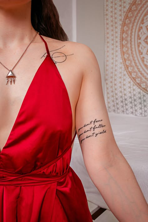 Cute Tattoo Arm quote bookquote dress tattooed girl Lyric Tattoos Placement Arm, Daring Greatly Tattoo, Quotes Arm Tattoo, Acotar Best Friend Tattoos, You Do Not Fear You Do Not Falter Tattoo, You Do Not Fear You Do Not Falter, Acotar Sleeve Tattoo, Acotar Quote Tattoo, Acotar Tattoo Quotes