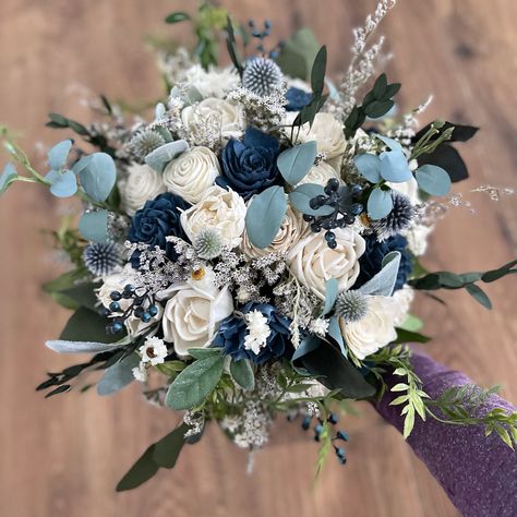 Sola wood wedding bouquet with steel blue accent flowers. Greenery is a mixture of artificial and preserved. Pictured is the size medium 10 inch bridal. Can also be made in smaller and bigger sizes. Can also make matching bridesmaid bouquets, corsages and boutonnières per request. Made to order, please allow up to 8 weeks for shipping. Each item is made to order so a slight variation may occur between one item and the next White And Sage Green Wedding, Blue And White Bridal Bouquet, Steel Blue Wedding, Steel Blue Weddings, White Calla Lily Bouquet, Wild Bouquet, Boho Wedding Colors, Green Wedding Bouquet, Green Wedding Flowers