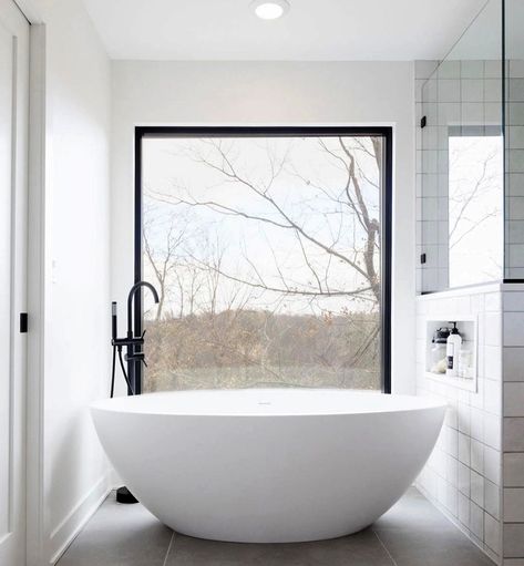 Black, white, and a whole lot of light! This massive picture window brings quite the "wow" factor to this little bathroom nook. Making a small space feel large, the black grille-less window allows light to pour in over this modern white bowl bathtub. Massive Bathroom, Window Bathroom, Large Bathtub, Contemporary Windows, Pella Windows, Window In Shower, Bathroom Window, Master Ensuite, Built In Shelf