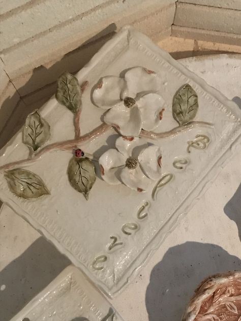 Believe plaque with dogwood bloom Clay Pieces Ideas, Clay Slab Ideas, Slab Relief Ideas, Ceramic Flower Tiles, Pretty Ceramics, Flower Plaques Wall Art, Flower Clay Tiles Design, Tile Relief Ceramics, Tile Art Projects