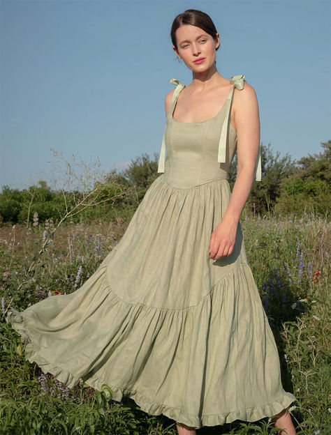 A truly special dress.  With rich ribbon tie straps, a corset bodice, and sweeping ruffle hem the Mirabelle Dress is dramatic, romantic beauty at its best and one of our most popular styles.  Made in a lightweight linen with a sateen finish that gives the linen a subtle dressy luster. A showstopper of a dress made for special moments, celebrations, or romantic getaways. Linen Bridesmaids Dresses, 2024 Summer Fashion, Linen Dress Ideas, Linen Bridesmaid Dress, Granny Clothes, Aesthetic Dress Outfit, Rustic Dress, Garden Dresses, Dramatic Romantic