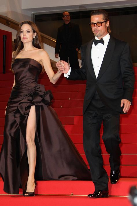 Angelina Jolie and Brad Pitt leave The Tree of Life premiere during the 64th Annual Cannes Film Festival on May 16, 2011, in Cannes, France. Getty -Cosmopolitan.com Angelina Jolie Make Up, Angelina Jolie Red Carpet, Versace Atelier, Angelina Jolie 90s, Angelina Jolie Style, Brad And Angelina, Brad Pitt And Angelina Jolie, Angelina Jolie Photos, Jolie Pitt