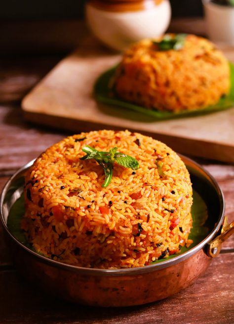 Learn how to make flavorful and tangy Tomato rice recipe, also known as Thakkali Sadam recipe, with this easy South Indian recipe. Perfect for lunch or dinner, this quick and delicious tomato rice dish is packed with spices and fresh tomatoes South Indian Rice Recipes, Tomato Rice Indian, Tomato Rice Recipe, Indian Rice Recipes, Tomato Rice, Indian Rice, Flavored Rice, Indian Recipe, Rice Dish