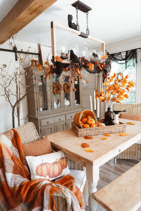 Using real branches in fall decor, spooky branches with crows, man on moon, fall signs, decorating hutch for fall, fall dining table decor Fall Por H Decor, Fall Cabin Decorating Ideas, Fall Decorated Dining Table, Homey Fall Decor, Fall Floral Mantle Decor, Fall Chair Decor, Autum Decorations Indoor Living Room, Dining Room Fall Decor Ideas, Decorating For Fall And Halloween