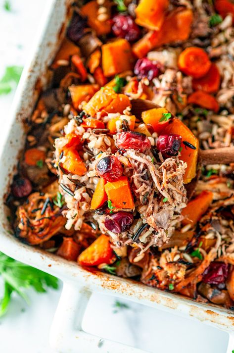 An easy, comforting, classic dish, this flavorful autumn chicken wild rice casserole recipe uses butternut squash, apples and cranberries for a fun fall twist. Plus, it's naturally gluten and dairy free! From aberdeenskitchen.com #autumn #chicken #wildrice #casserole #fall #dinner #familyfriendly #recipe Butternut Squash Wild Rice Casserole, Chicken And Wild Rice Casserole With Butternut Squash And Cranberries, Chicken And Wild Rice Casserole Healthy, Autumn Casserole Recipes, Healthy Fall Casserole Recipes, Wild Rice Casserole Recipes, Dairy Free Fall Recipes, Wild Rice Butternut Squash, Dinner Party Casseroles