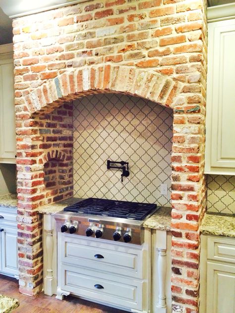 Brick arch over range stove Arched Brick Stove Alcove, Kitchen With Brick Arch Over Stove, Stove With Brick Surround, Arched Cooking Alcove, Brick Kitchen Hood Stove, Brick Arch Kitchen Stove, Brick Arched Fireplace, Brick Arches In Kitchen, Brick Kitchen Units