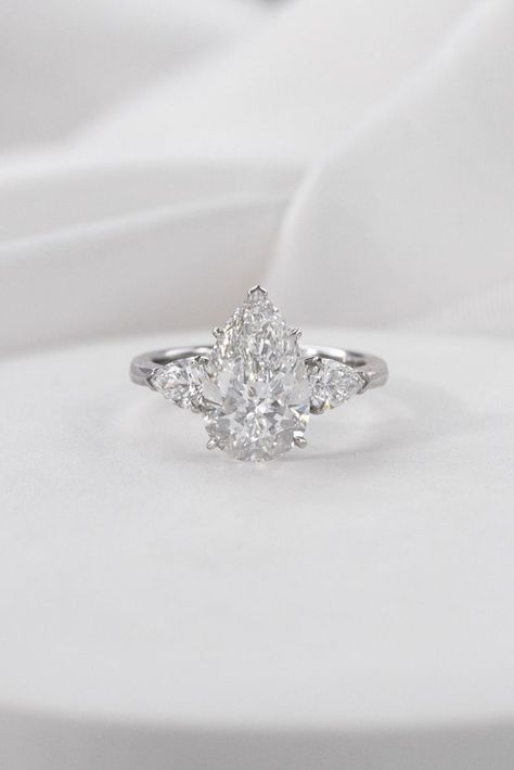 Diamond Rings Pear Shape, Pear Diamond With Side Stones, Pear Shape Diamond Engagement Rings, Pear Engagement Ring Silver Band, Silver Pear Shaped Engagement Ring, Pear Shaped Engagement Rings White Gold, Pear Three Stone Engagement Ring, Silver Pear Engagement Ring, Pear Engagement Ring Silver