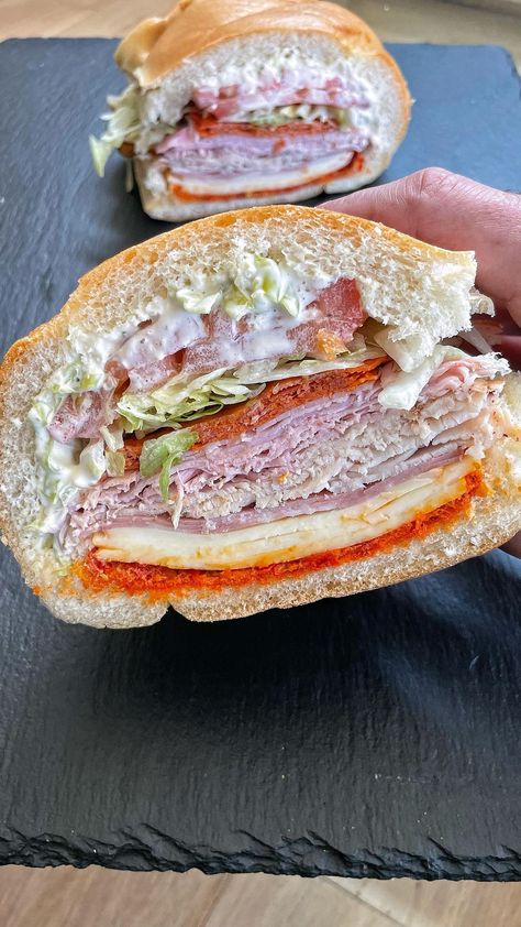 Hoagie Sandwiches Recipes, Italian Sandwich Recipes, Hoagie Sandwiches, Calabrian Chili Paste, Josh Elkin, Grinder Sandwich, French Loaf, Rolled Sandwiches, Sliced Tomatoes