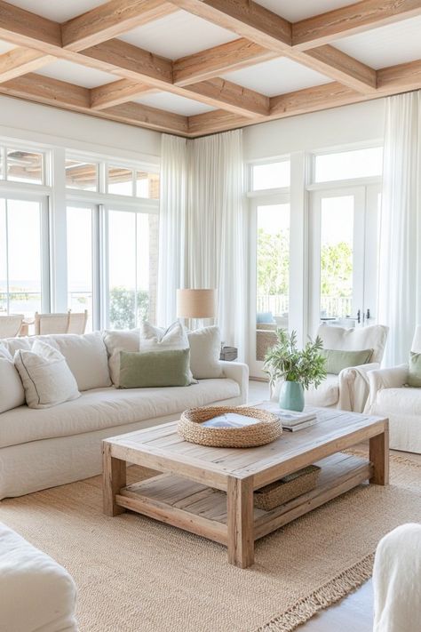 Create a cozy, warm space with these tips for a coastal living room. Coastal Formal Living Room, Modern Organic Coastal Living Room, Neutral Costal Interior Design, French Coastal Living Room, Calm Coastal Living Room, Soft Contemporary Home Interiors, Scandinavian Interior With Color, Coastal Sunroom Ideas, Classic Coastal Living Room