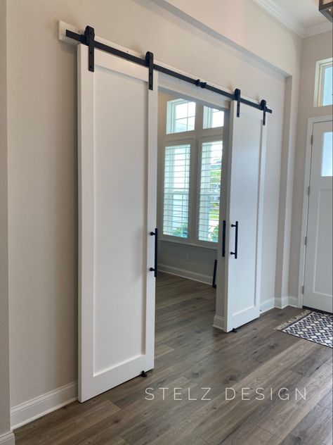 Barn Doors For Den, Sliding Door Basement, White Barn Doors In The House, Living Room Barn Doors, Barn Door Laundry Room, Office Barn Door, Barn Doors In The House, White Barn Doors, Interior Door Makeover