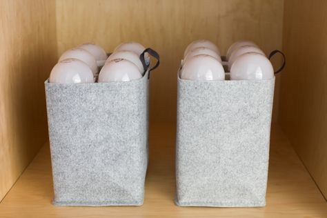 What’s Inside: The Stealth Utility Closet Light Bulb Organization Ideas, Lightbulb Storage Ideas, Light Bulb Organization, Light Bulb Storage Ideas, Lightbulb Storage, Light Bulb Storage, Stylish Storage Ideas, Closet Baskets, Ikea Must Haves