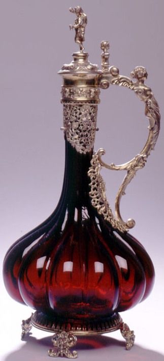 A Masterpiece unsigned A continental silver gilt mounted fluted ruby glass decanter, probably Austro-Hungarian, circa 1870. Ht. 14 1/4". Glass Objects, Beautiful Perfume Bottle, Austro Hungarian, Cranberry Glass, Vintage Perfume Bottles, Glass Decanter, Vintage Perfume, Antique Glass, Decanters