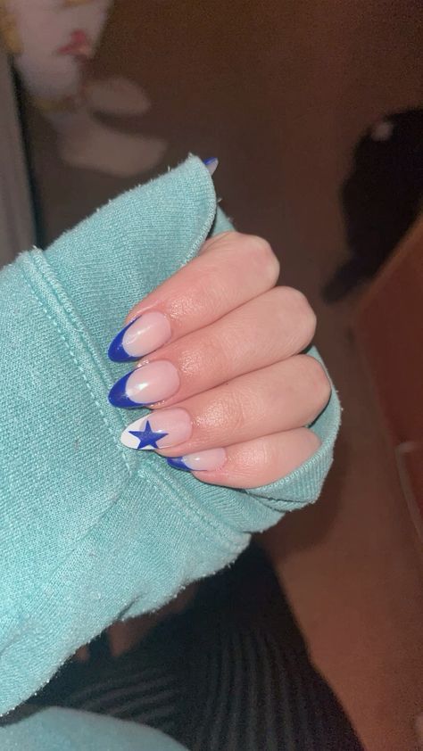 Cute Acrylic Nails Stars, French Tip Nail With Star, Nails Acrylic Almond Stars, Grad Nails Acrylic Almond, Acrylic Nails French Tip Designs, Blue With Stars Nails, Blue French Tip Nails With Stars, One Star Nails, Blue Concert Nails