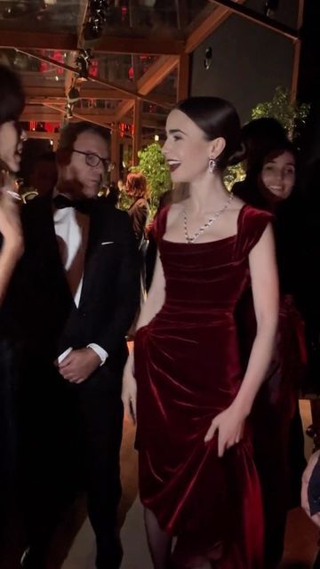 Eternal Goddess on Instagram: "Actress Lily Collins glows in a red velvet gown at a @cartier event ❤️ 🎥 @galafr - #eternalgoddess #emilyinparis #cartier #redcarpetfashion #redvelvet #couturegown" Lily Collins Cartier, Dark Red Dress Prom, Royal Gowns Princesses, Red Outfit Dress, Dark Red Formal Dress, Lily Collins Outfit, Red Velvet Dress Outfit, Red Velvet Design, Red Dress Outfits