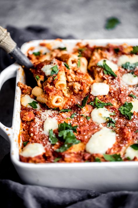 A new take on baked ziti with this lightened up saucy baked pumpkin pasta with creamy pumpkin puree, ground turkey sausage, red bell pepper, mushrooms, marinara, ricotta, mozzarella, parmesan, parsley and your favorite pasta! #pastarecipe #healthydinner #dinnerrecipe #pumpkinrecipe #fallrecipe #familydinner Pumpkin Pasta Bake, Autumn Pasta Recipes, Pumpkin Pasta Recipe, Ground Turkey Sausage, Pumpkin Lasagna, Fall Pasta, Pumpkin Recipes Healthy, Pumpkin Pasta, Ambitious Kitchen