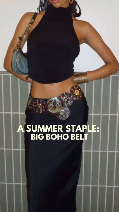 A black high neck tank is paired with a long maxi skirt and a jean shoulder bag. A big circular belt is laying flat around the waist of the skirt, give the outfit a boho look. Disk Belt Outfit, Boho Belt Outfit, Circle Belt Outfit, Wide Belt Outfit, Big Belt Outfit, Western Belt Outfit, Trendy Belts For Women, Belted Skirt Outfits, Western Belts Outfit