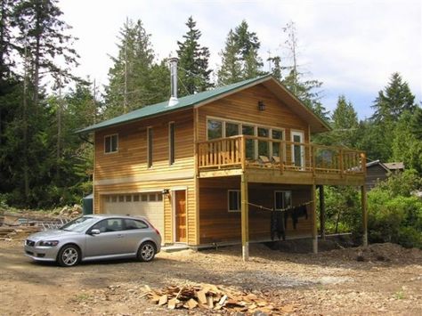 This small 576 square foot house is located on Gabriola Island in British Columbia and has two stories, a 24′ by 24′ footprint, type-3 septic field, instant hot water heater, and cork floors. Plan Garage, Landscaping Around House, Garage Loft, Garage Apartment Plans, Garage House Plans, Garage Apartment, Apartment Plans, Small Cabin, Cabin Ideas