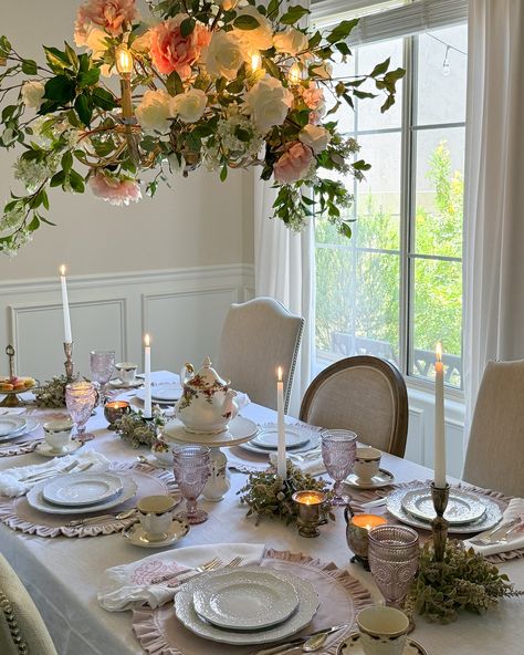 A Bridgerton inspired tea party, featuring a chandelier extravagantly decorated with faux peonies, roses, lilac stems and ficus, to add a touch of charm and whimsy to the occasion. The elegant dishes and linens are from one of my very favorite fancy shops, @arteitalicacrownlinen 🩷 #tablescape #frenchcountry #traditionalhome #bridgertondecor #bridgertoninspired #flowers #flowerarrangement #diningroom #teaparty Bridgerton Table Decor, Bridgerton Table Setting, Over The Table Rod, Faux Peonies, Elegant Dishes, Small Bud Vases, Bridgerton Party, Bridgerton Vibes, Hanging Tea Lights