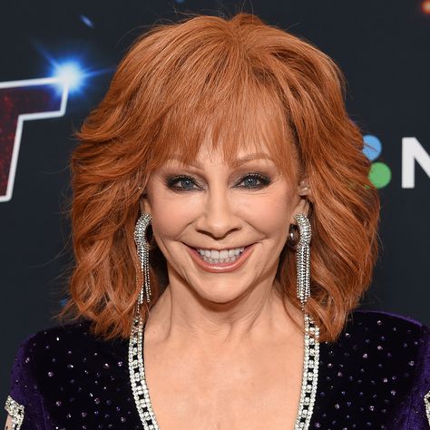 Reba McEntire Shuts Down 'Voice' Exit Rumors: 'This Is Not True' Reba Hairstyles, Reba Red Hair Color, Reba Fancy Shirt, Reba Mcentire Songs, Reba Mcentire Concert, Reba Memes Funny, Striped Halter Top, Singing Competitions, New Children's Books