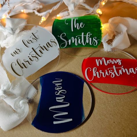 Custom Christmas Ornaments 🎄 LINK ON MY BIO❤️ I N C L U D E S - acrylic ornament - vinyl lettering - painted brushstrokes on back - silk ribbon attached - ornament is 3 inches round . . . . . . #customornaments #christmasornaments #merrychristmas #christmasdecorations #christmastreedecorating #ornamentsforfamily Vinyl Ornament Ideas, Vinyl Ornaments, Custom Christmas Ornaments, Diy Vinyl, Ornament Ideas, Custom Ornament, Vinyl Lettering, Easy Gifts, Custom Christmas