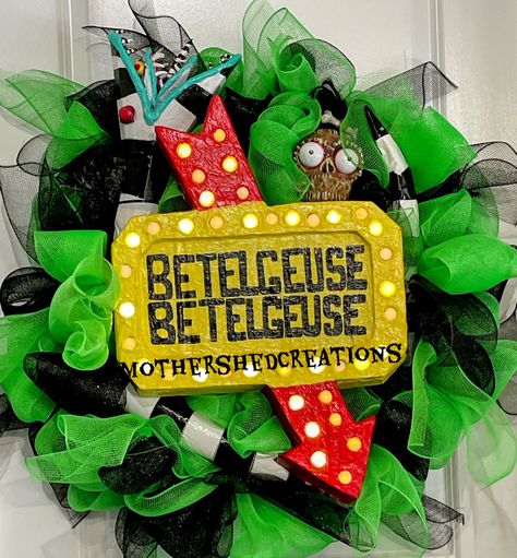 This Beetlejuice Wreath is totally handmade. The Betelgeuse sign is fully functional with remote control lights. Each piece is handmade. Great accessory to your Halloween decorations. This wreath is made on a 16 inch wreath form. Bettlejuice Wreath, Beetlejuice Wreath Ideas, Beetlejuice Wreath Diy, Beetlejuice Themed Decor, Jeep Wreaths, Beetlejuice Door Hanger, Beetle Juice Wreath, Beetlejuice Outdoor Decorations, Dollar Tree Halloween Wreath Diy