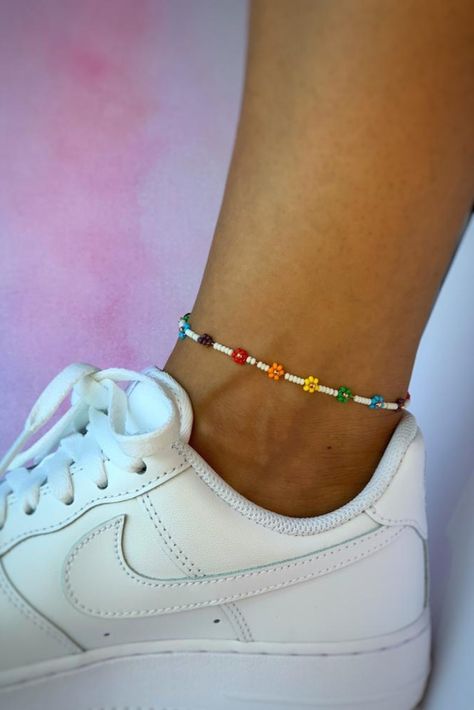 Click here to add a little rainbow bloom to your jewelry collection. This adorable daisy piece is everything you need to show your flower power. If you love dainty jewelry, this one is for you. Daisy Anklet, Rainbow Daisy, Bead Anklet, Daisy Jewelry, Matching Keychains, Beaded Anklet, Rainbow Flower, Daisy Bracelet, Flower Choker