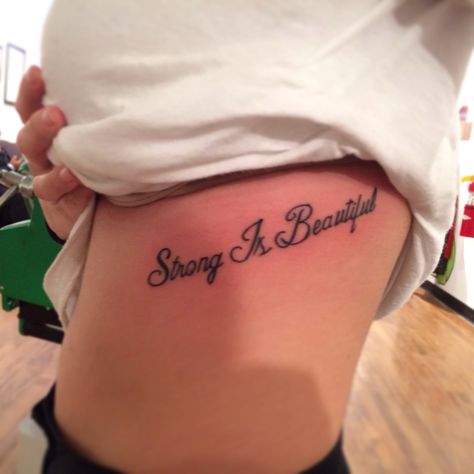 Strong Is Beautiful <3 Strong Is Beautiful Tattoo, Strength Tattoo Designs, Inspirational Wrist Tattoos, Cute Tattoos Quotes, Tattoo Writing Styles, Shoulder Tattoos For Females, Tattoo With Meaning, Wrist Tattoos Words, Infinity Tattoo With Feather