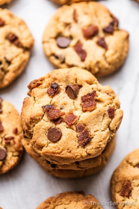 Bacon peanut butter cookies are THE BEST cookies ever. They're soft and chewy and packed with an incredible salty/smoky/sweet flavor from the bacon, bourbon, and peanut butter. It's the perfect combination and makes for one amazing cookie! #theendlessmeal #cookies #baconcookies #peanutbuttercookies #peanutbutterbaconcookies #bacon #peanutbutter #bestcookies #cookierecipe Whiskey Cookies, Bacon Desserts, Peanut Butter Bacon, Bacon Cookies, Bourbon Bacon, Hazelnut Recipes, Chocolate Bacon, Best Cookies Ever, Spice Cookies