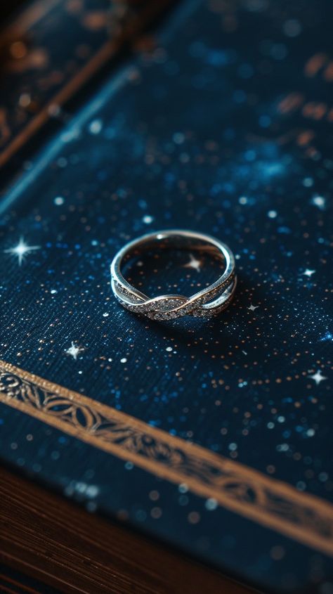 Elegant #jewelry Display: An intricately designed #silver ring gracefully placed atop a #celestial-themed book cover, evoking a sense of #magic. #ring #elegant #aesthetic #design #artistry #aiart #aiphoto #stockcake ⬇️ Download and 📝 Prompt 👉 https://stockcake.com/i/elegant-ring-display_269584_53591 Celestial Jewelry Aesthetic, Celestial Photoshoot, Intricate Rings, Book Rings, Stunning Diamond Rings, Ring Display, Ring Elegant, Elegant Engagement Rings, Jewelry Aesthetic