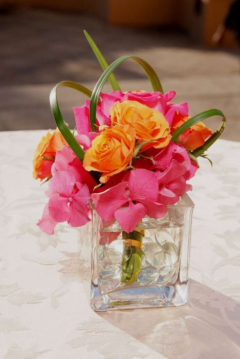 Orange Rose and Pink Rhododendron Centerpiece Veuve Centerpiece, Pink Purple Orange Centerpiece, Pink Orange Centerpiece, Pink And Orange Decor Birthday Parties, Pink And Orange Decorations, Pink And Orange Party Decor, Pink And Orange Centerpieces, Pageant Decorations, Pink And Orange Flower Arrangements