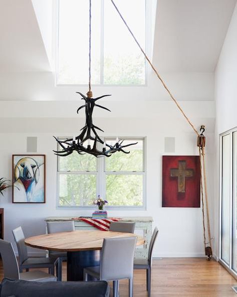 The chandelier is cool, but I just really love the natural light in this room. Pulley Light Fixture, Pulley Light, Cottage Dining, Unusual Lighting, Swag Chandelier, Room Styling, Pulley System, Dining Design, Leather Side Chair