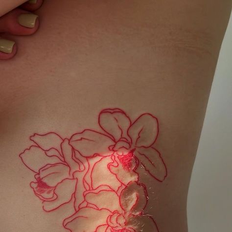 Flower Tattoos Red Ink, Tiny Tattoos Red Ink, Back Of Neck Flower Tattoo, Red Orchid Tattoo, Red Line Tattoos, Red Line Tattoo, Red Flower Tattoo, Red Tattoo Aesthetic, Red Tattoo Ideas