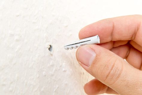 Want to hand something heavy but cant seem to locate a stud behind the wall? Drywall anchors provide a great alternative. In this video, get the step-by-step for using this handy piece of hardware without any hassles. https://www.moneypit.com/use-drywall-anchors/ Drywall Installation, Drywall Anchors, Wood Studs, Drilling Holes, Drywall, Anchors, Drill Bits, Being Used