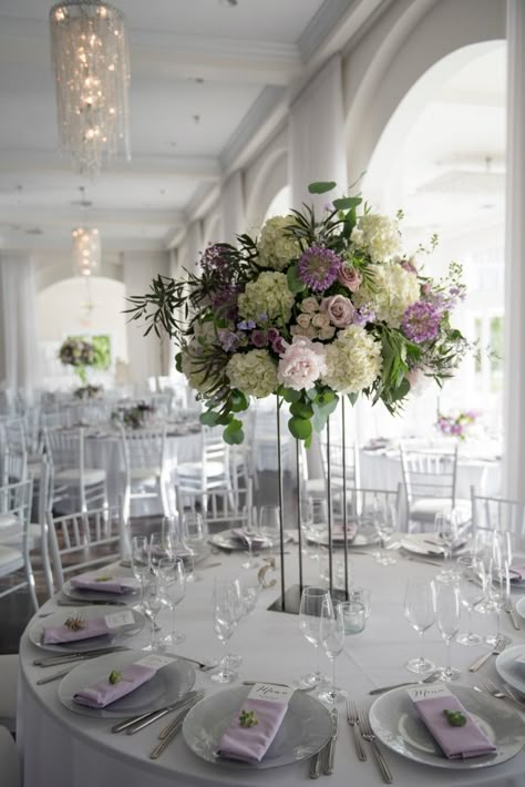 Medium Height Wedding Centerpieces, Purple And Green Wedding Decorations Table Centerpieces, Wedding Ideas Lilac, Lilac And Green Wedding, Violet Wedding Theme, Lavender And Silver Wedding, Purple Wedding Reception Decorations, Lavender Wedding Centerpieces, Purple Flower Centerpieces