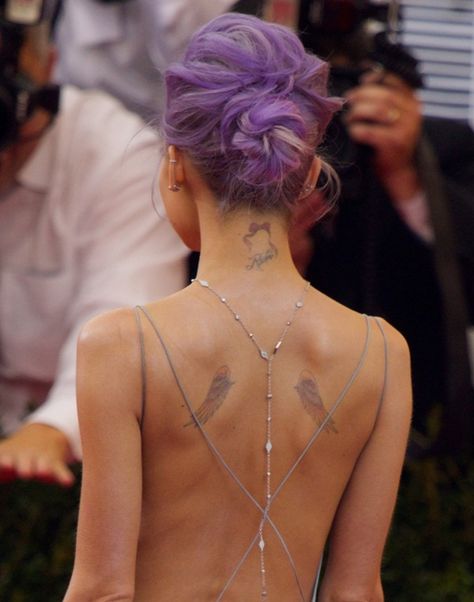 Nicole Richie showing off a sexy back that showed her angel wings, along with two other small tats on the back of her neck Angel Wings Tattoo On Back, Small Angel Wing Tattoo, Wing Tattoos On Back, Small Back Tattoos, Small Tats, Angel Wings Tattoo, Back Tattoo Women, Wings Tattoo, Celebrity Tattoos