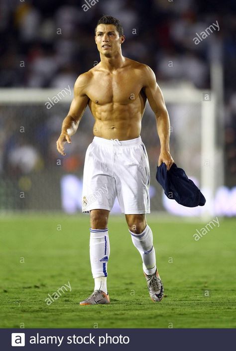 Download this stock image: Cristiano Ronaldo removes his Real Madrid soccer jersey after his team defeated the Los Angeles Galaxy 3-2 at the Rose Bowl, Pasadena, California. August 2010 - 2BX5XJ6 from Alamy's library of millions of high resolution stock photos, illustrations and vectors. Ronaldo Body, Cristiano Ronaldo Body, Body Man, Body Pic, Running Drills, Cr7 Jr, Real Madrid Soccer, Celebrity Bodies, Hottest Male Celebrities