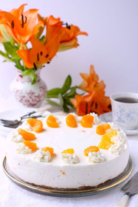 Mandarinen Sahnetorte is a German cream torte dotted with juicy mandarin orange segments. It's light and creamy and fluffy, melting on your tongue in a divine cloud of bright citrus tanginess. What a way to celebrate spring - or summer, or a birthday, a graduation, Mother's Day, or just a special Sunday! The base is a light sponge cake layer and the top is a creamy gelatin-set mousse made of Greek yogurt, whipped cream, and mandarin orange segments. #creamtorte #Germantorte #orangecreamtorte Yogurt Whipped Cream, Greek Yogurt Whipped Cream, German Dishes, Grilled Fruit, Sweet Dips, Canadian Food, German Chocolate Cake, Special Cake, Mandarin Orange