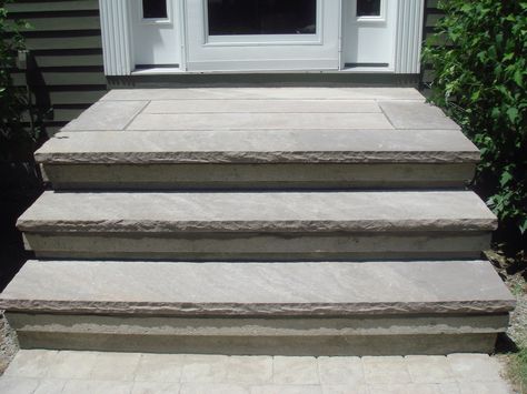 Concrete steps overplayed with brown stone treads Concrete Entryway Front Porches, Front Steps Stone, Paver Stairs, Lake House Patio, Concrete Front Steps, Cement Steps, Front Porch Stone, Entry Steps, Concrete Backyard