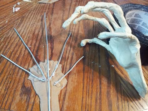 Diy Scary Halloween Hands, Halloween Shadow Figures, Paper Mache Hands Diy, Cardboard Halloween Props, Creepy Hands Halloween Diy, Diy Halloween Hands, Halloween Cardboard Crafts, Paper Mache Halloween Decorations, Cardboard Halloween Decorations Diy