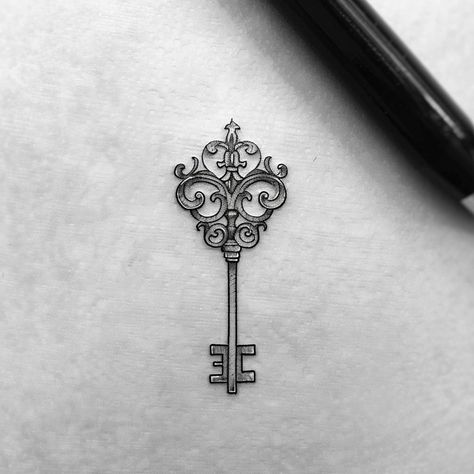 Unlock the door to your soul with this captivating black and grey key tattoo. Featuring swirling designs and a classic fleur-de-lis, it symbolizes opening new paths and securing treasured memories. Let this piece inspire you to embrace your journey. Save & follow for more unique ink inspiration. #KeyTattoo #VintageVibes #IntricateInk #SoulJourney #Inkspiration #FleurDeLisDesign #TattooArt #AiImage Black Keys Tattoo, New Orleans Inspired Tattoo, Old Key Tattoo, Key And Lock Tattoo, Vintage Key Tattoos, New Orleans Tattoo, Key Tattoo Designs, Lock Tattoo, Tattoos 2023