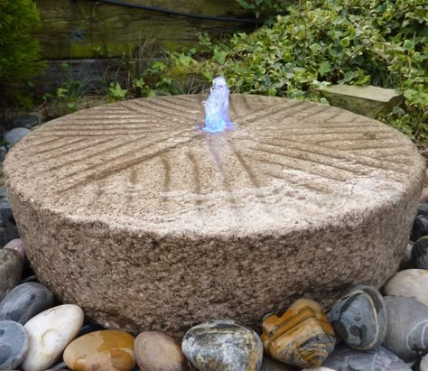 Old millstone/grindstone fountain | Hypertufa in landscaping. Mill Stone, Stone Water Features, Container Water Gardens, Unique Garden Art, Outdoor Water Features, Garden Water Feature, Diy Garden Fountains, Solar Fountain, Stone Fountains